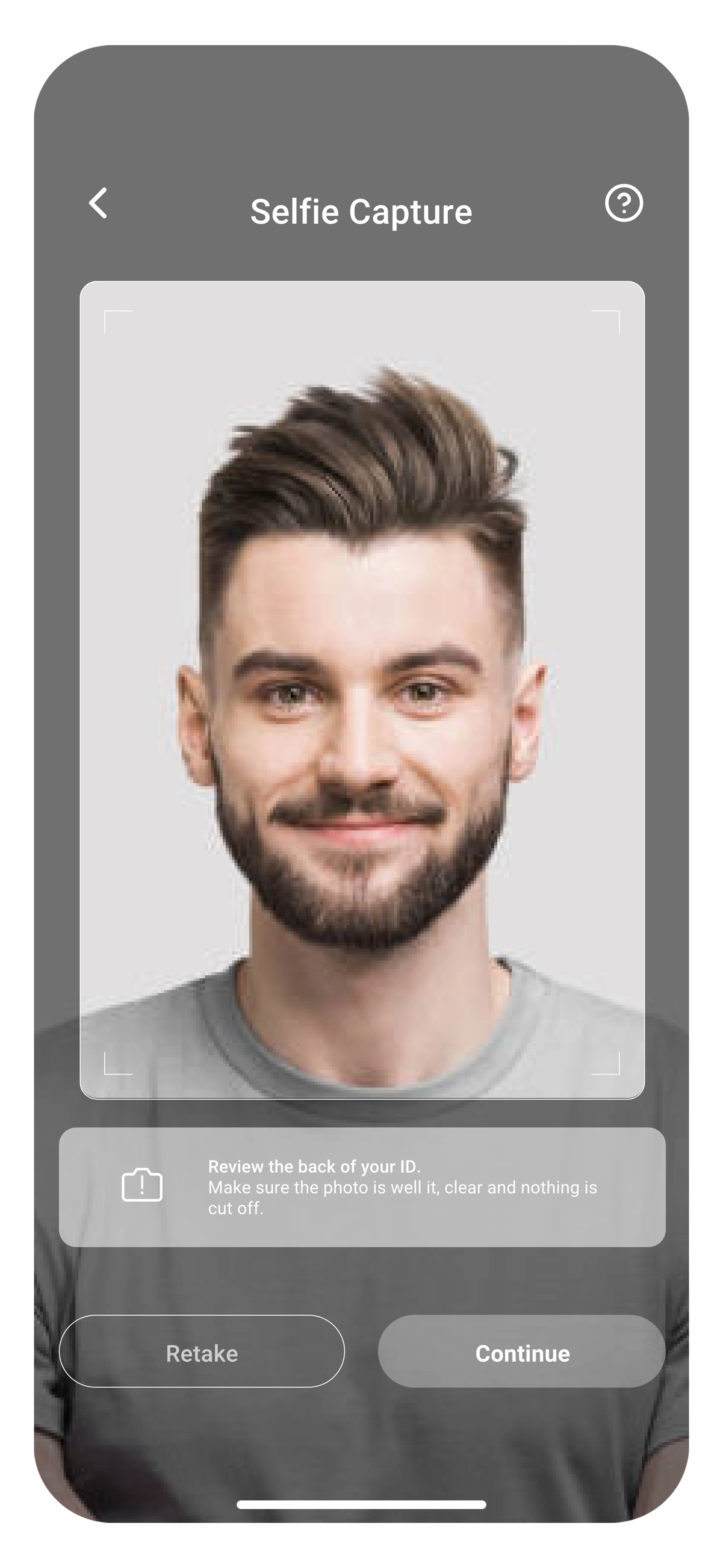 Selfie Capture screen with retake and continue options